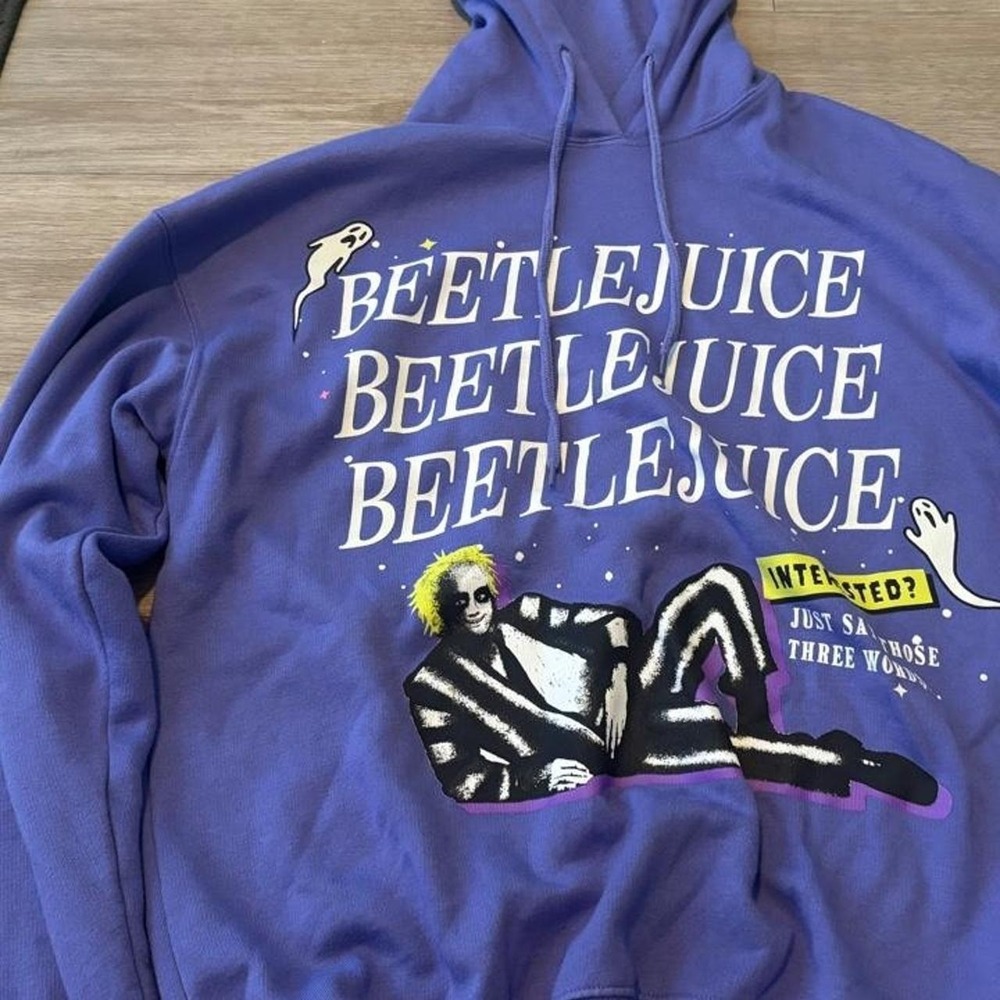 Beetlejuice graphic hoodie in a vibrant purple color